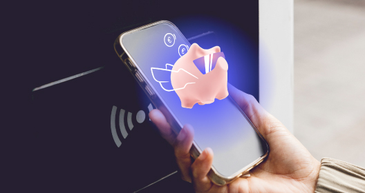Person pays for a purchase with a phone, and the Citadele app’s smart piggy bank is visible on the screen.